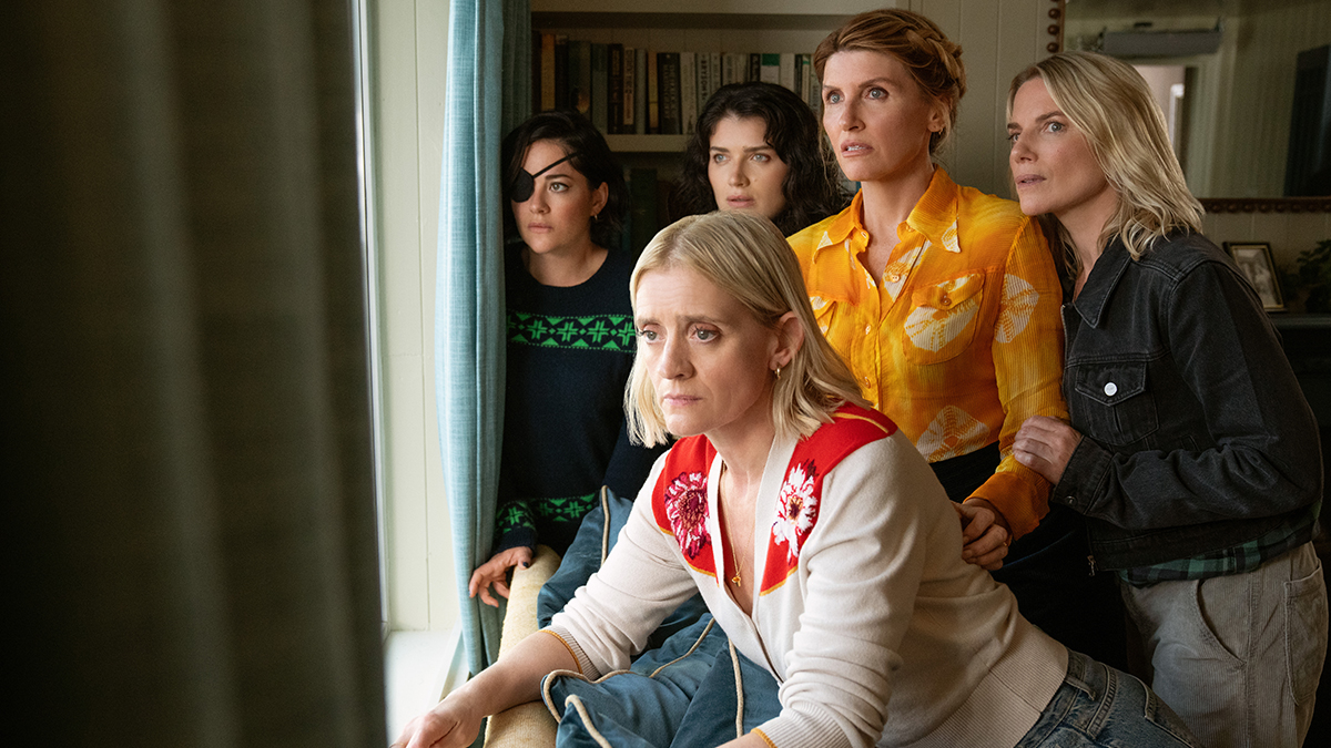 The Garvey Sisters looking out of a window in Bad Sisters season 2 on Apple TV+